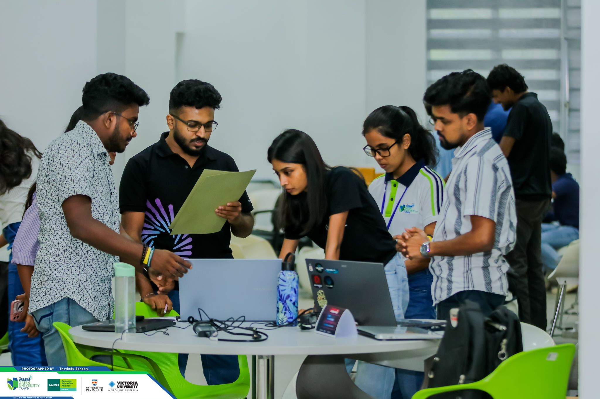 Pasindu Bandarigoda judging an inter-university competition at NSBM